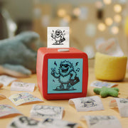Kids printing stickers at the table